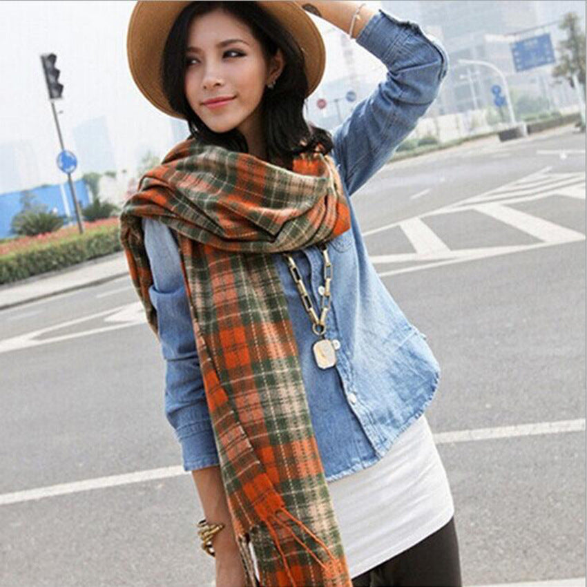 Woman wearing multi-style winter shawl scarf outdoors