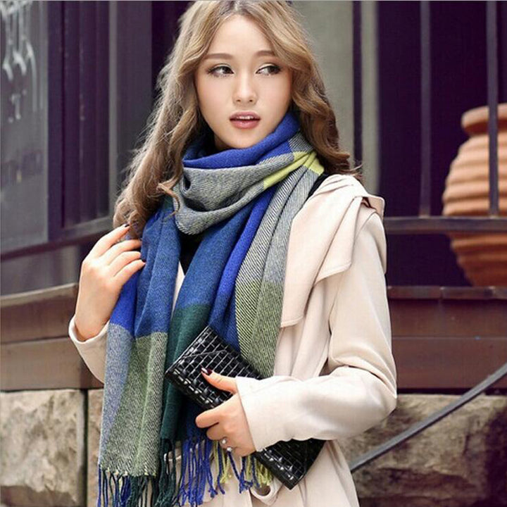 Woman wearing multi-style winter shawl scarf outdoors