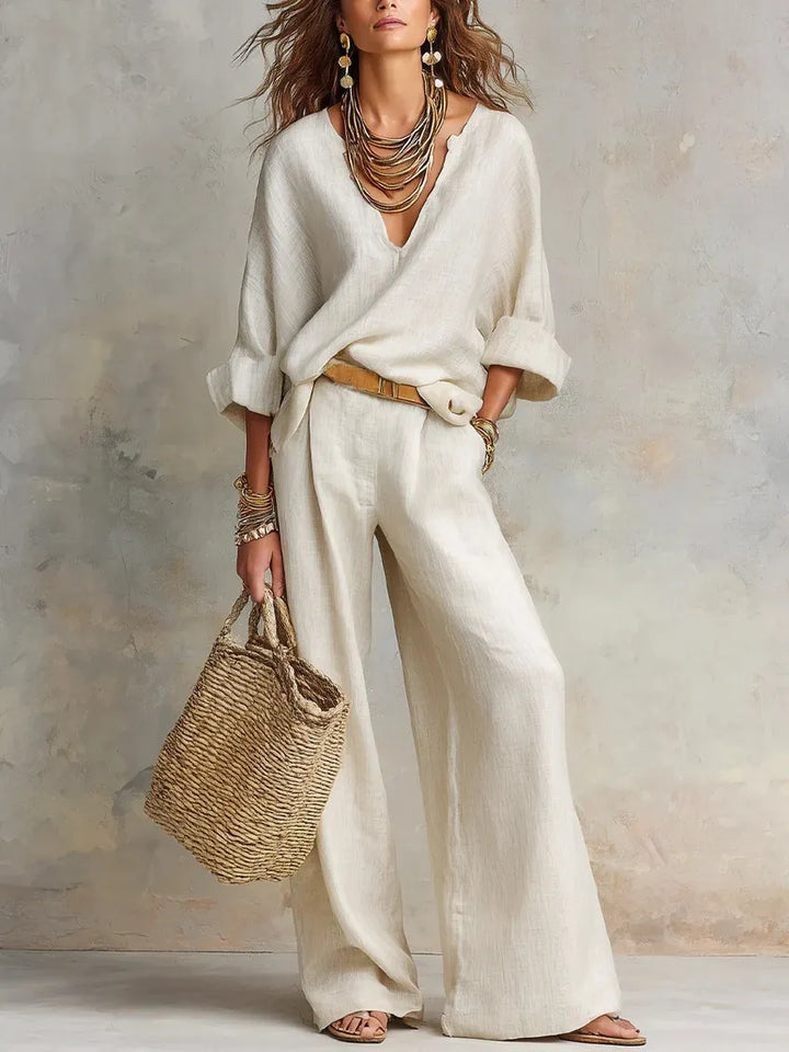 Woman wearing relaxed V-neck two piece set with wide-leg trousers