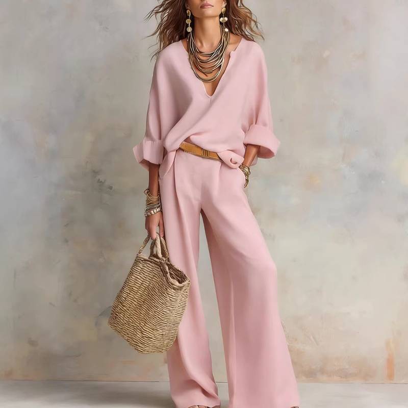 Woman wearing relaxed V-neck two piece set with wide-leg trousers