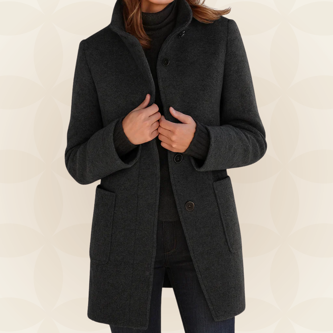 Woman wearing high collar button front coat outdoors