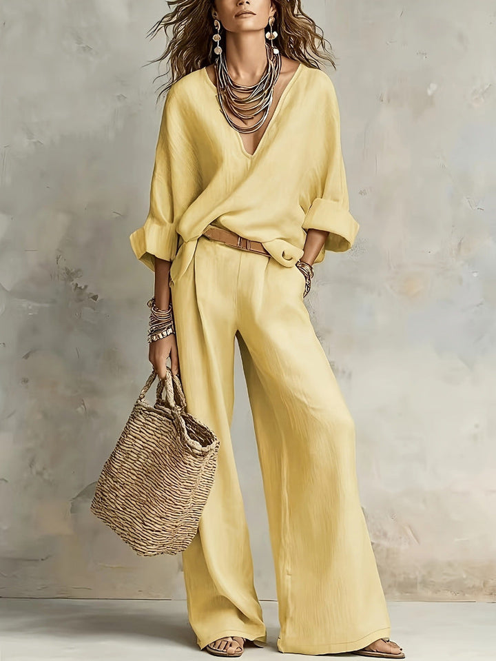 Woman wearing relaxed V-neck two piece set with wide-leg trousers