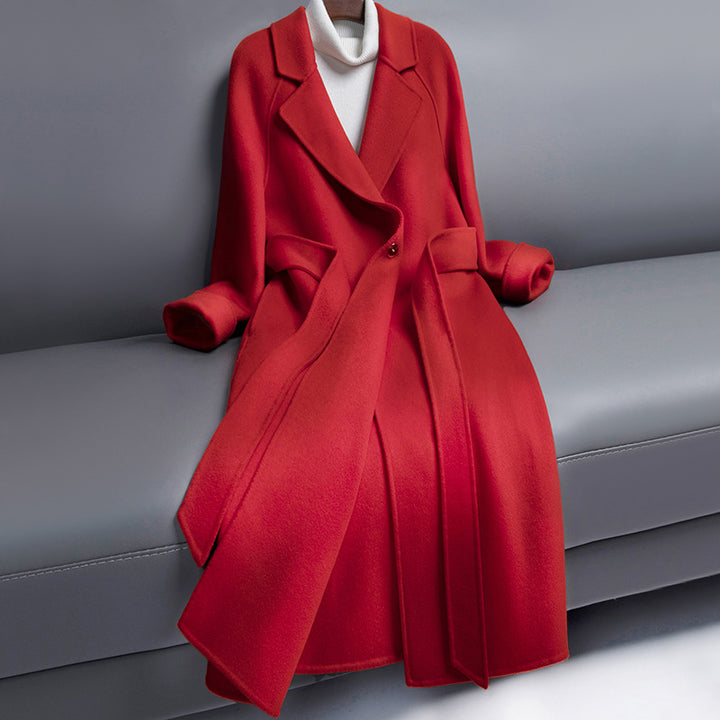 Woman wearing long wool winter coat with belt