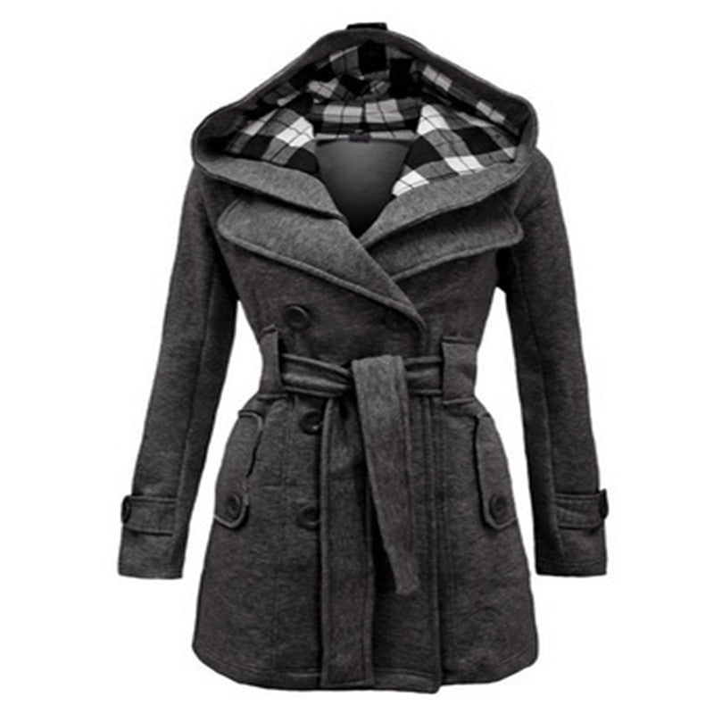 Woman wearing double-breasted winter coat with large collar