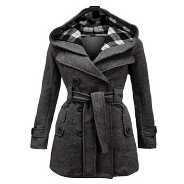Woman wearing double-breasted winter coat with large collar
