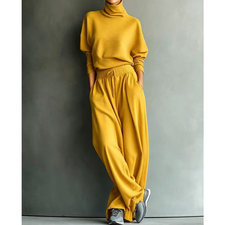 Woman wearing black turtleneck two-piece set with wide-leg trousers