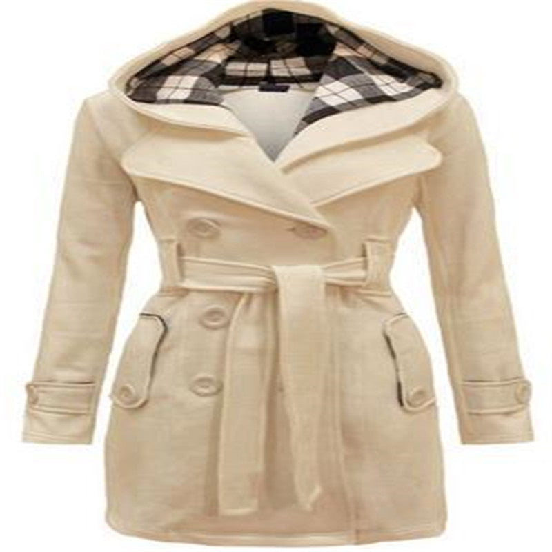 Woman wearing double-breasted winter coat with large collar