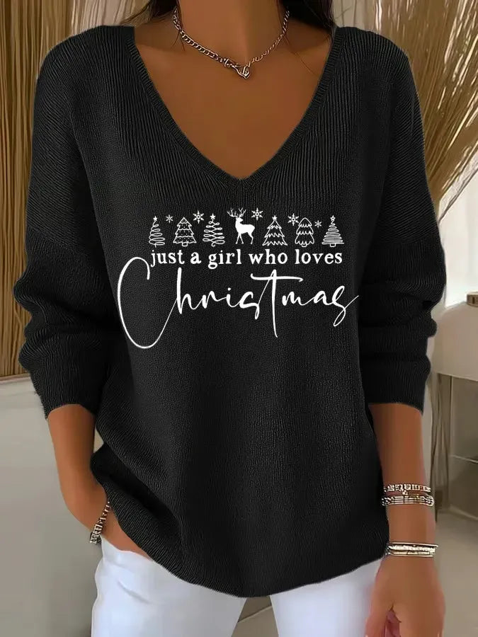 Woman wearing V-neck Christmas sweater with festive print