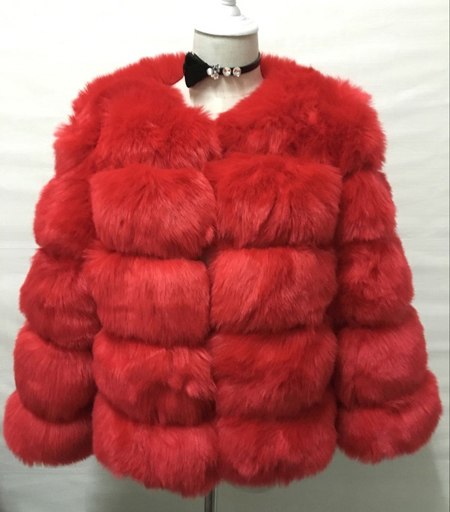 Woman wearing pink short faux fur coat with horizontal panels