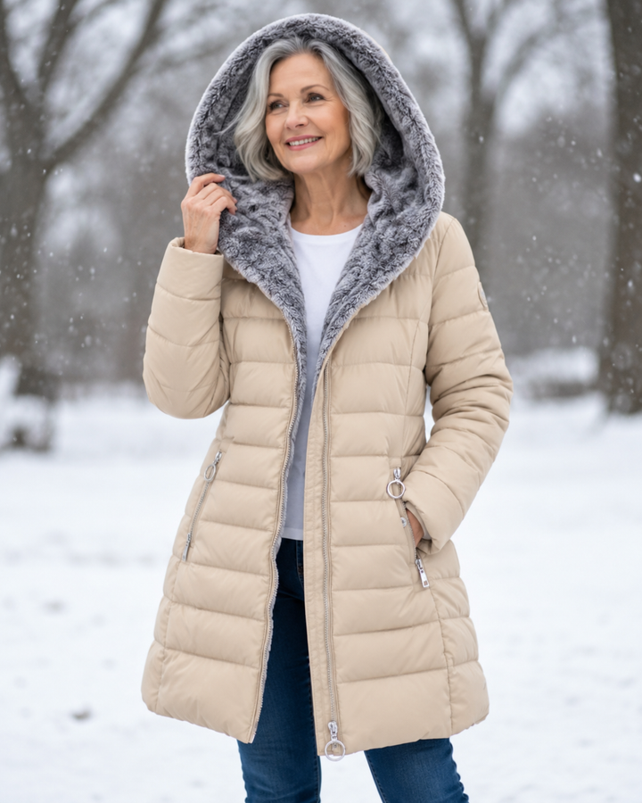 Woman wearing quilted hooded winter coat with A-line fit