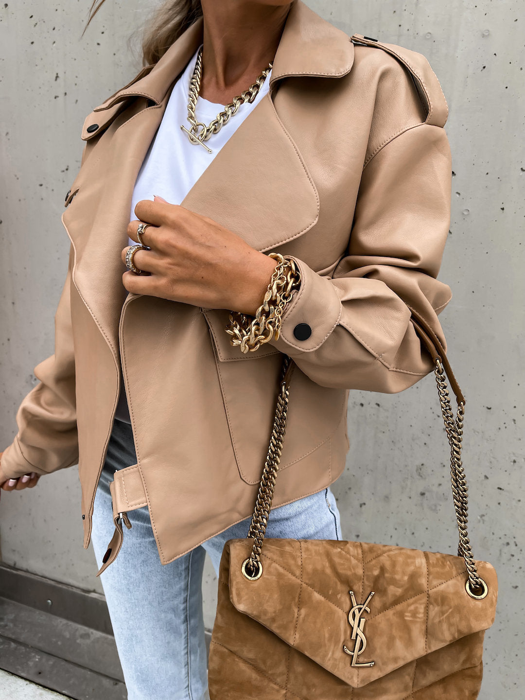 Woman wearing loose black PU leather lapel jacket