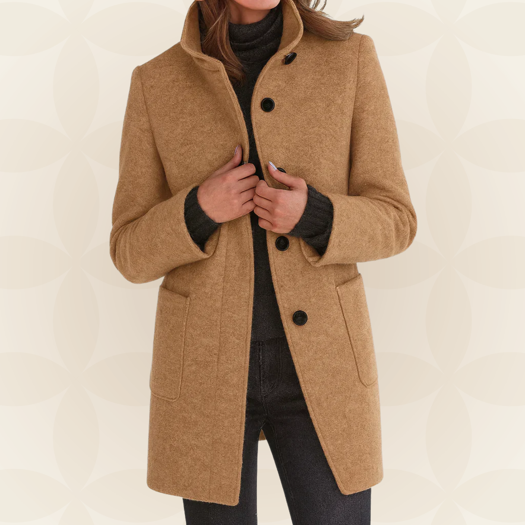 Woman wearing high collar button front coat outdoors