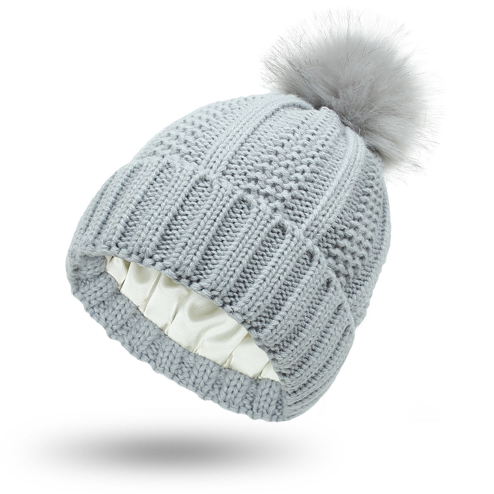 Women's satin lined knit beanie with pom pom