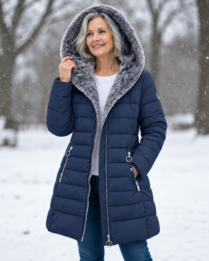 Woman wearing quilted hooded winter coat with A-line fit