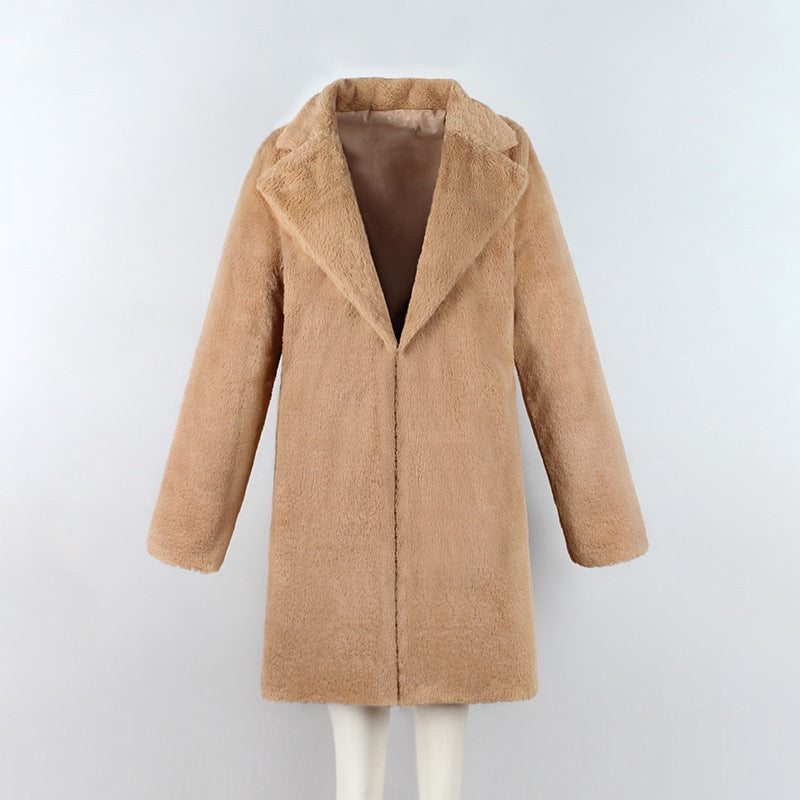Woman wearing long faux fur coat in streetwear style
