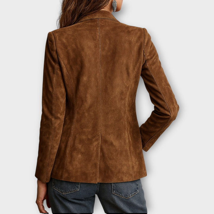 Woman wearing brown structured blazer with front buttons