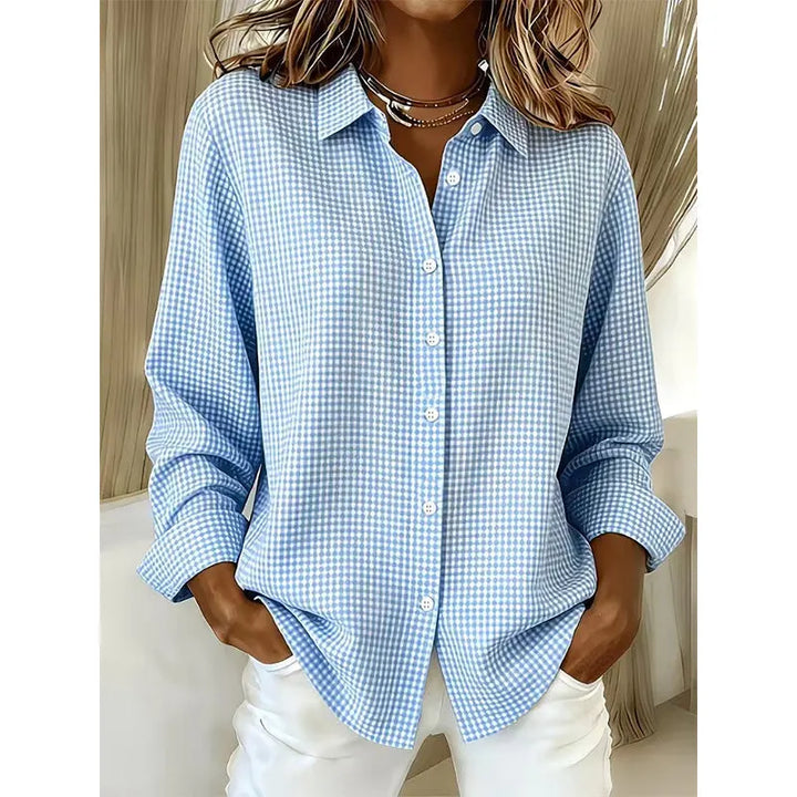 Woman wearing gingham button-front blouse with long sleeves