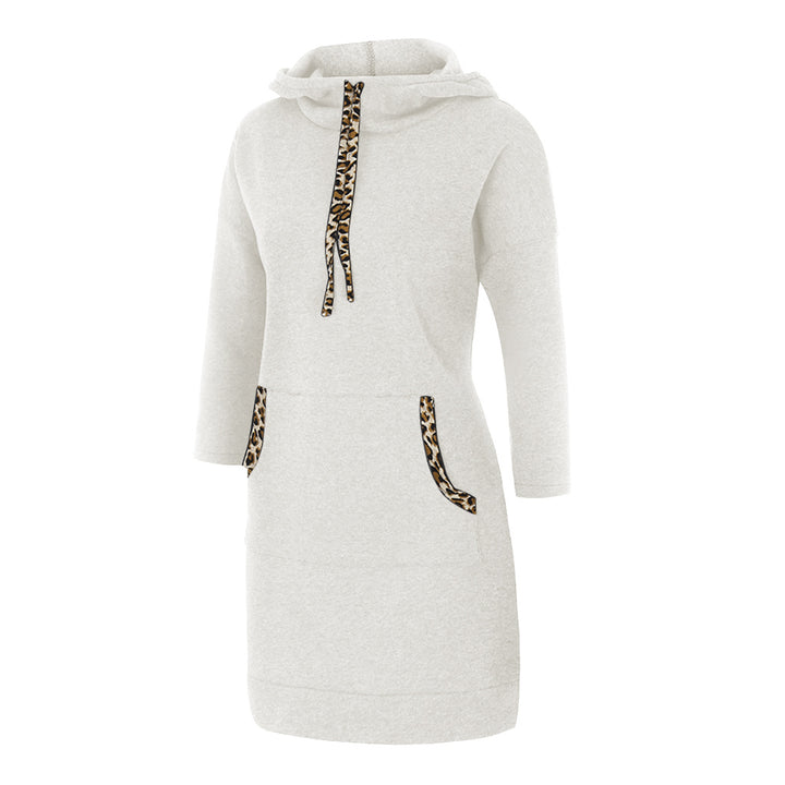 Woman wearing hooded sweatshirt dress with leopard-print drawstrings