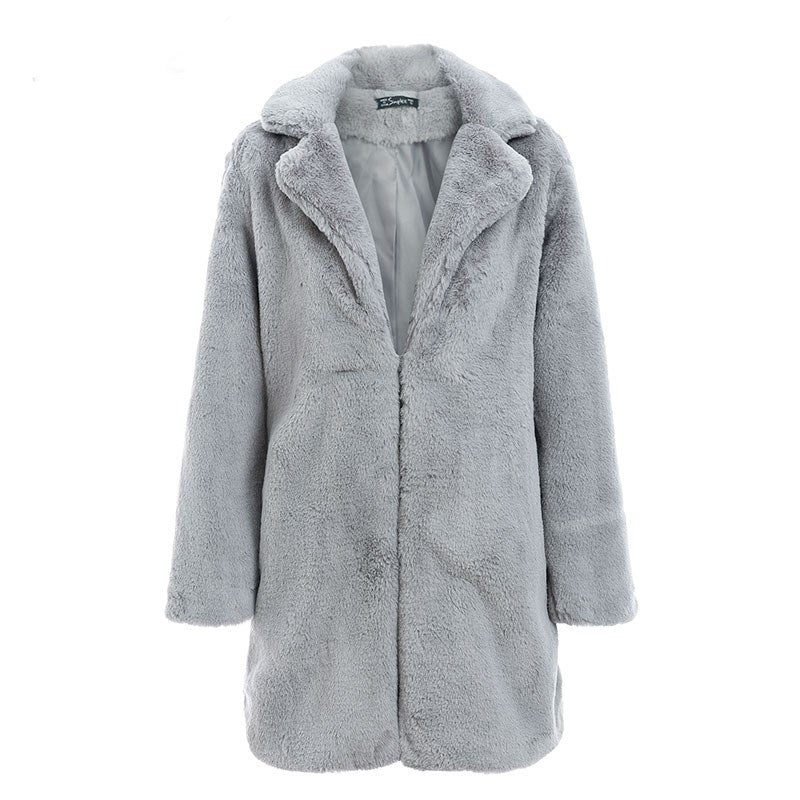 Woman wearing long faux fur coat in streetwear style