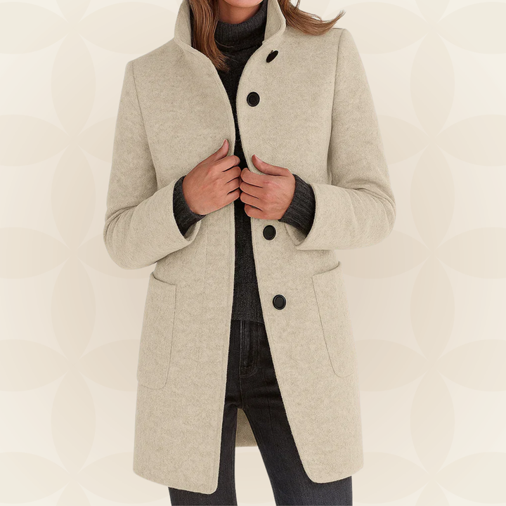 Woman wearing high collar button front coat outdoors