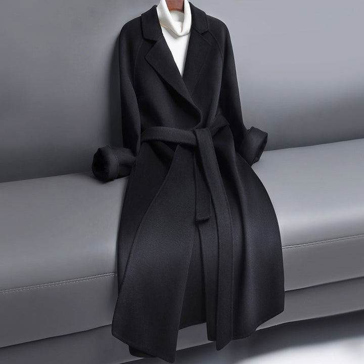 Woman wearing long wool winter coat with belt