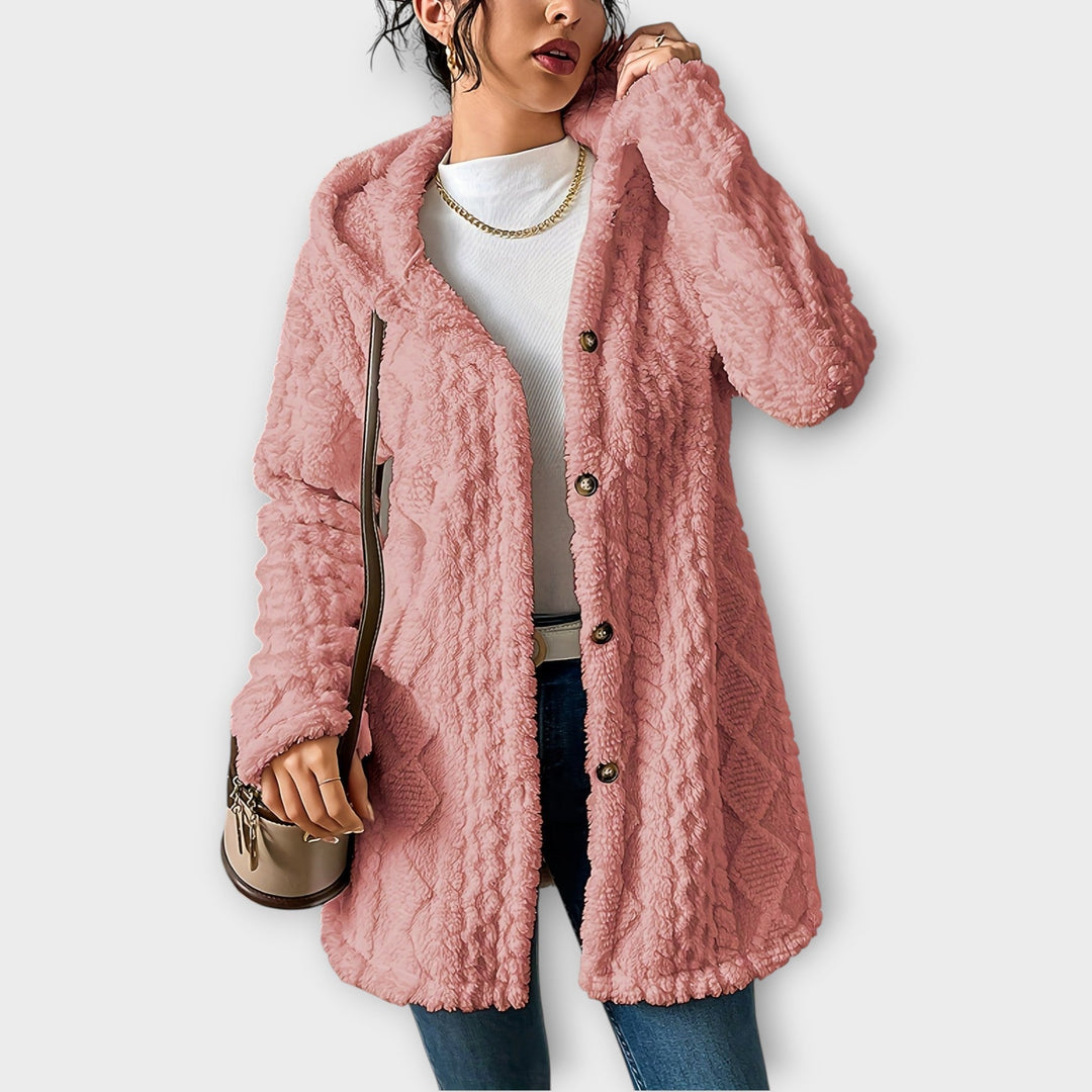 Woman wearing textured hooded winter jacket in relaxed fit