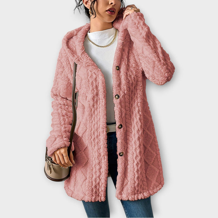 Woman wearing textured hooded winter jacket in relaxed fit
