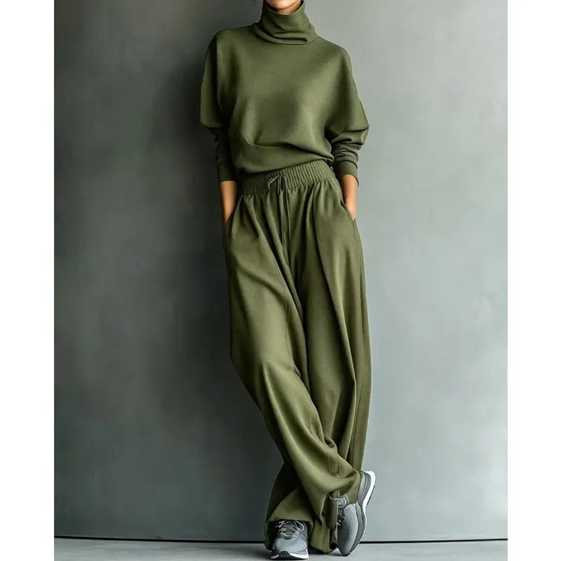 Woman wearing black turtleneck two-piece set with wide-leg trousers