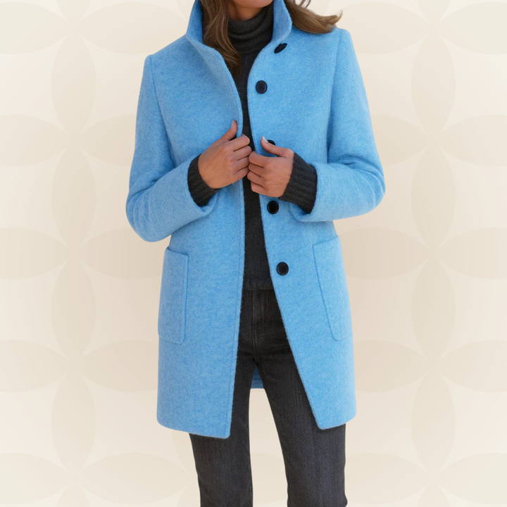 Woman wearing high collar button front coat outdoors