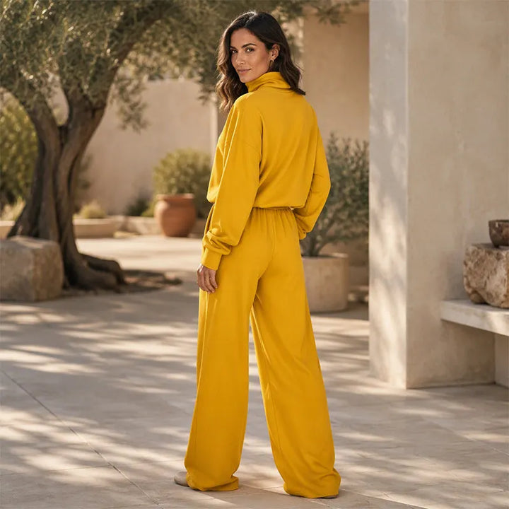 Woman wearing black turtleneck two-piece set with wide-leg trousers