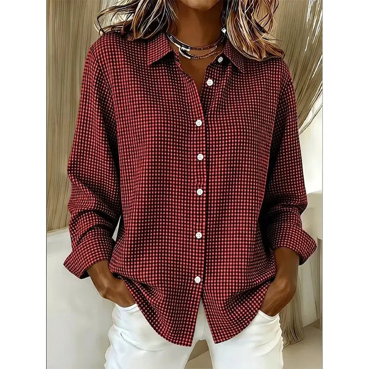 Woman wearing gingham button-front blouse with long sleeves