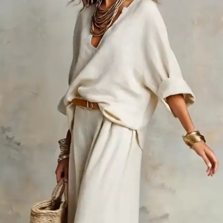 Woman wearing relaxed V-neck two piece set with wide-leg trousers
