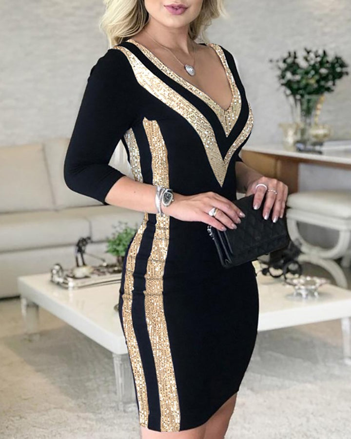 Woman wearing black and white sequin stitched printed dress