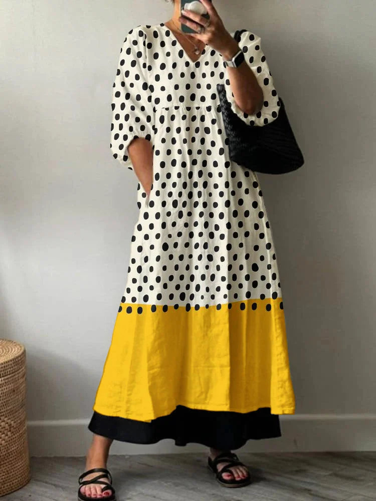 Woman wearing white and black geometric summer maxi dress