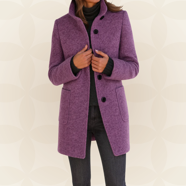 Woman wearing high collar button front coat outdoors