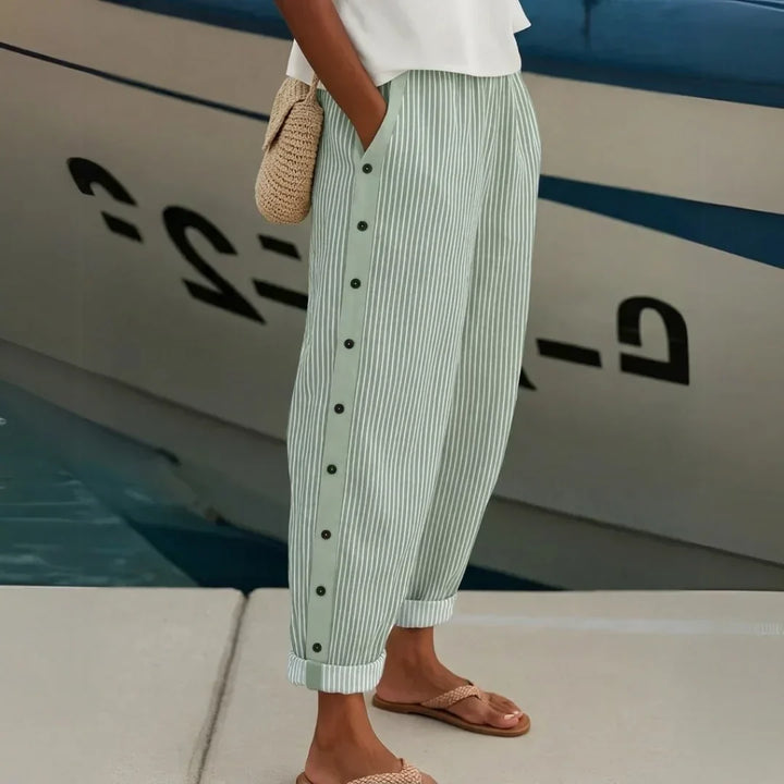 Woman wearing striped button front high waist pants