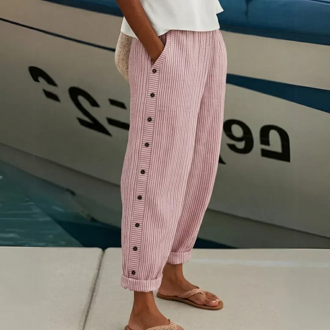 Woman wearing striped button front high waist pants