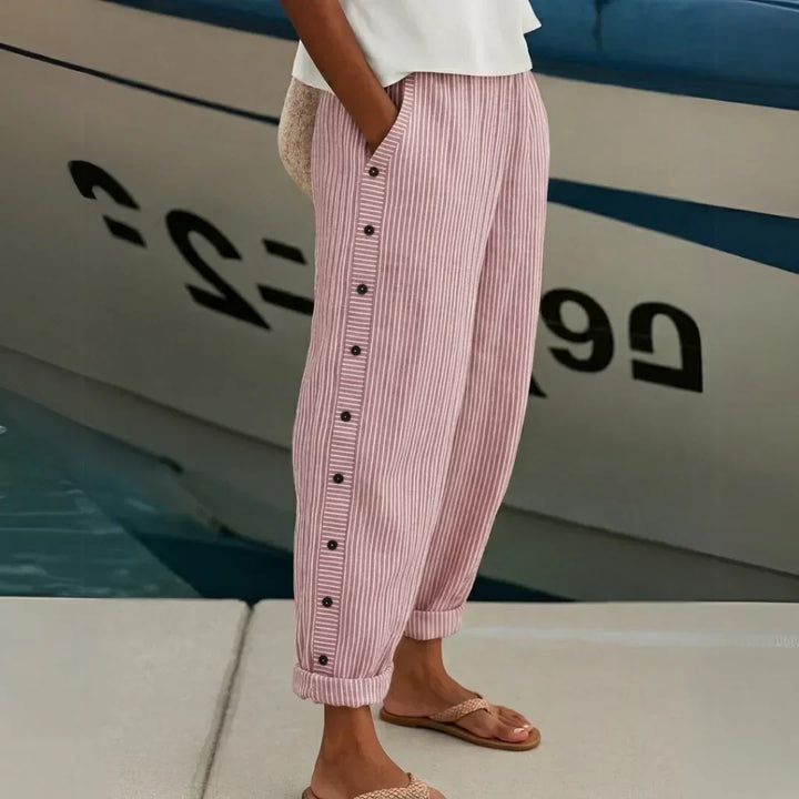Woman wearing striped button front high waist pants