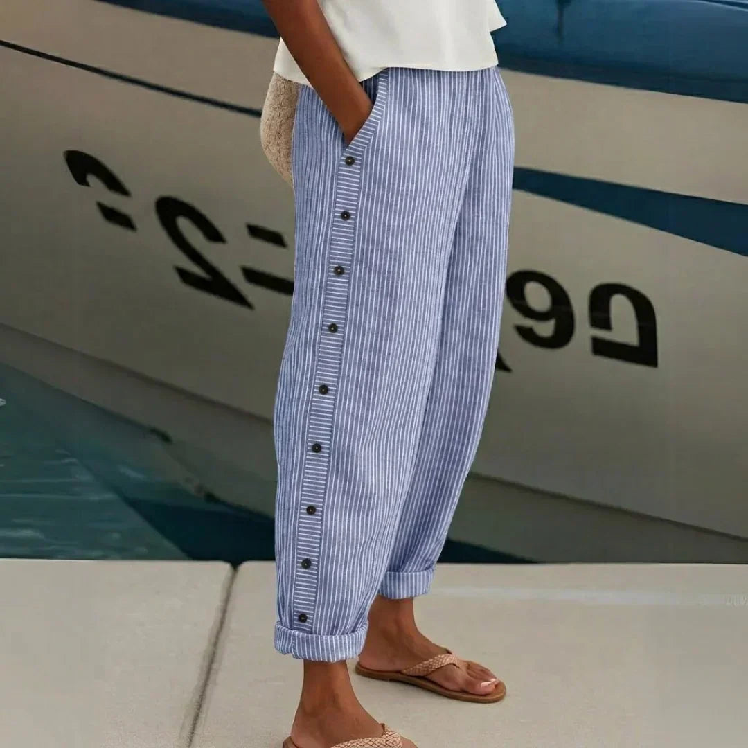 Woman wearing striped button front high waist pants