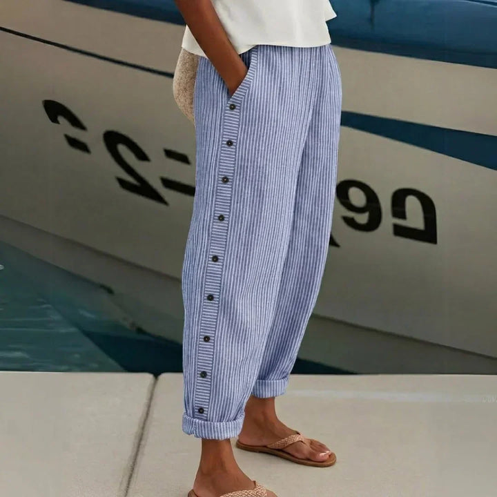 Woman wearing striped button front high waist pants