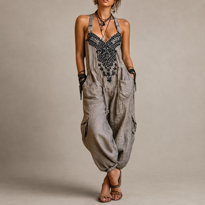 Woman wearing embroidered boho harem jumpsuit with pockets