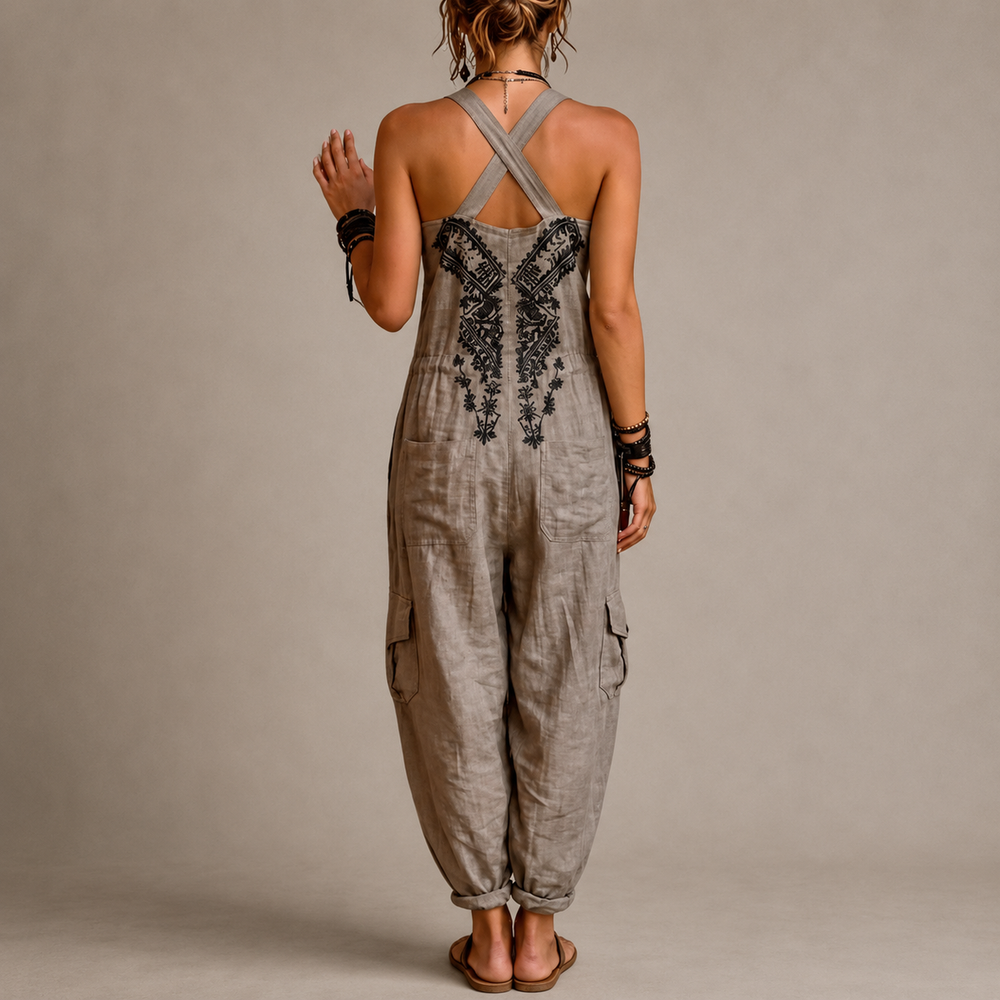 Woman wearing embroidered boho harem jumpsuit with pockets
