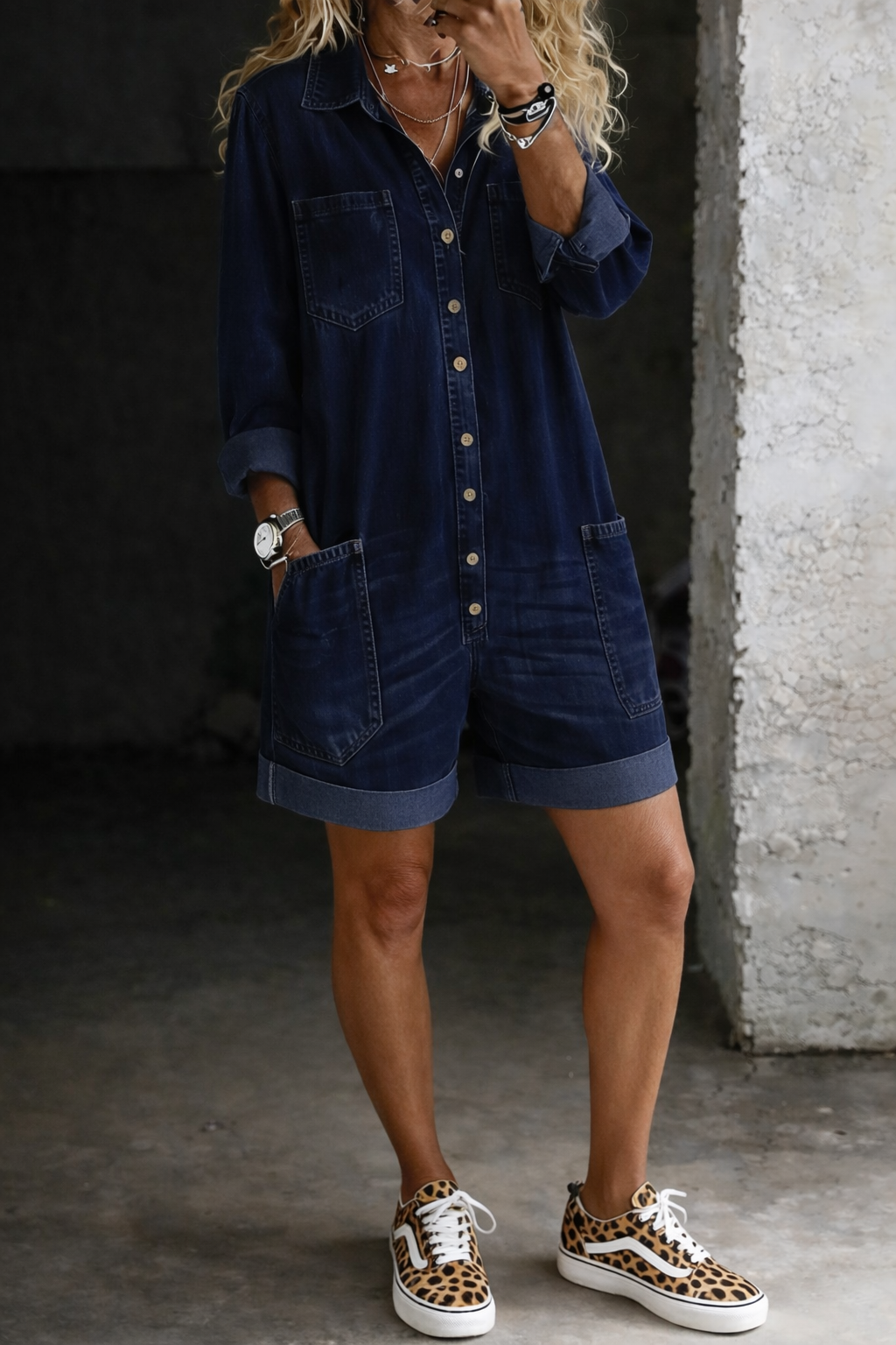 Woman wearing short denim-inspired jumpsuit outdoors