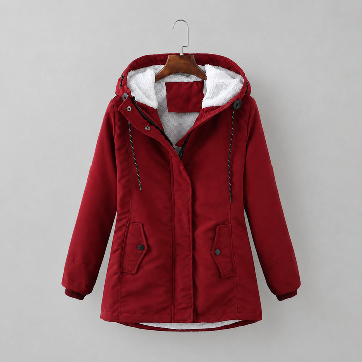 Woman wearing long quilted hooded winter coat outdoors
