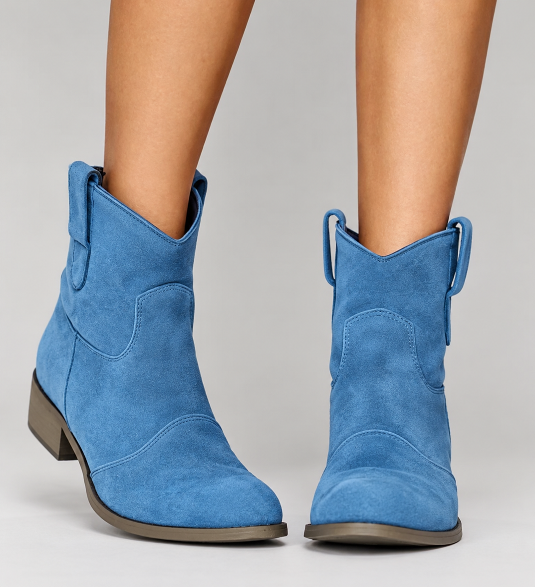 Woman wearing block heel orthopedic boots with side zip
