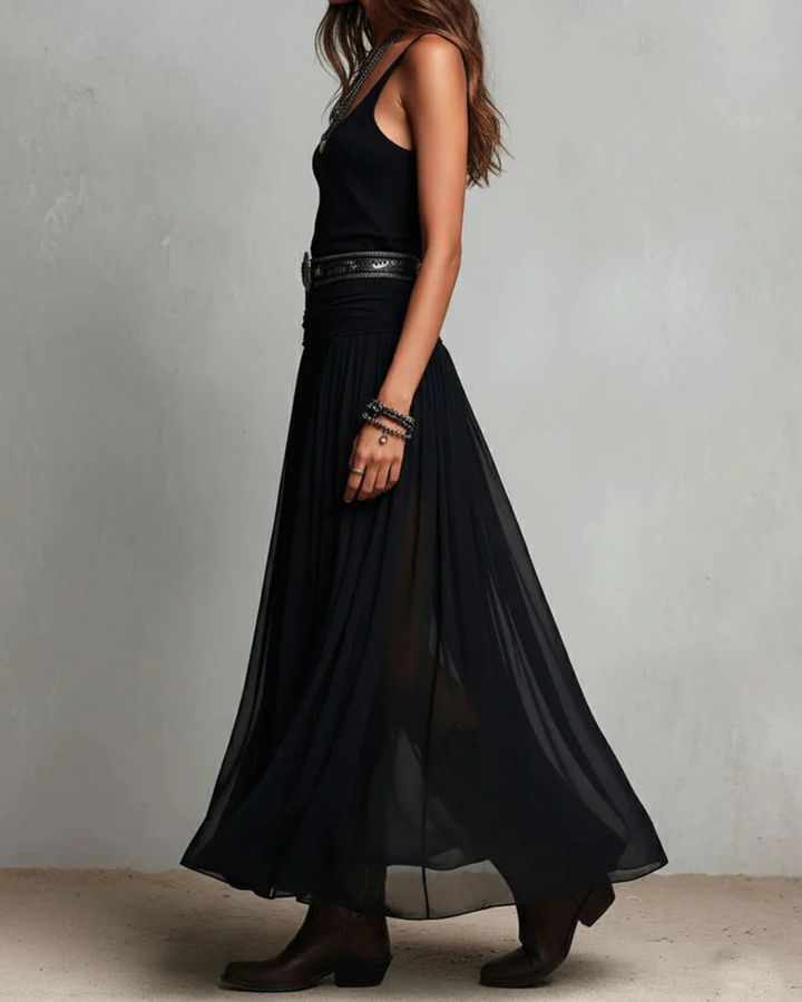 Woman wearing double layer maxi dress with sheer overlay