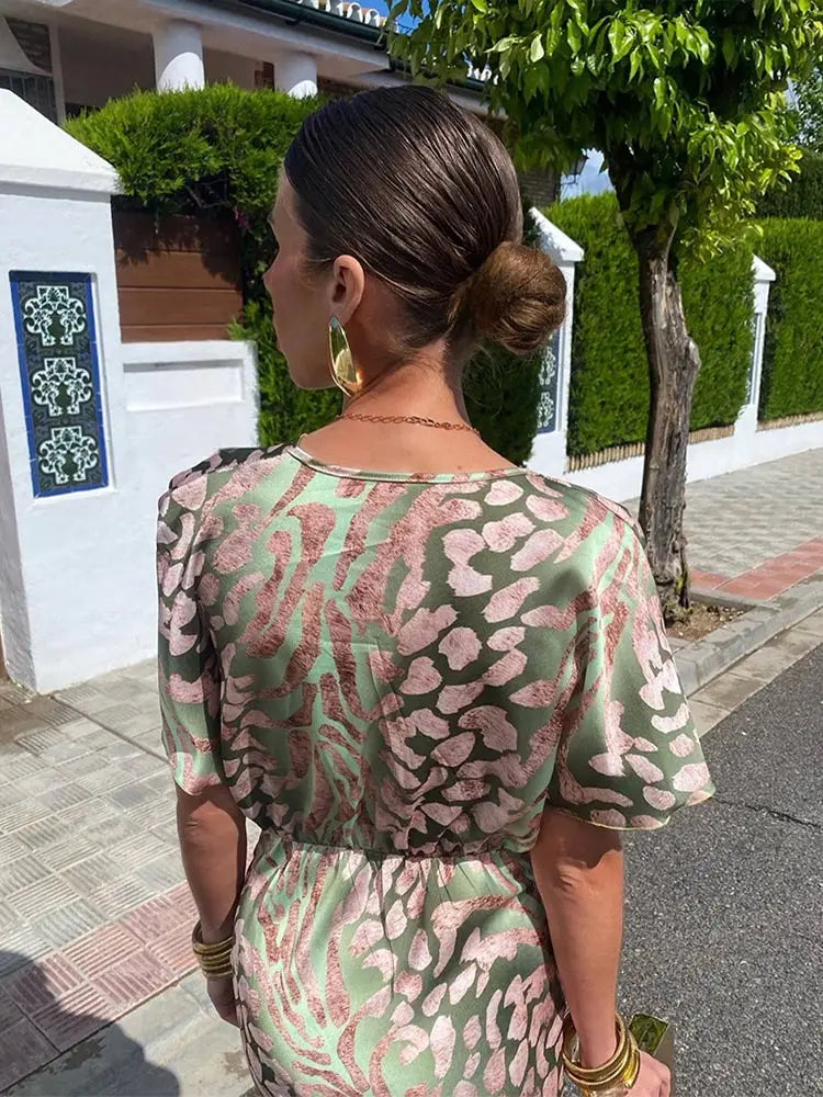 Woman wearing V-neck wrap maxi dress
