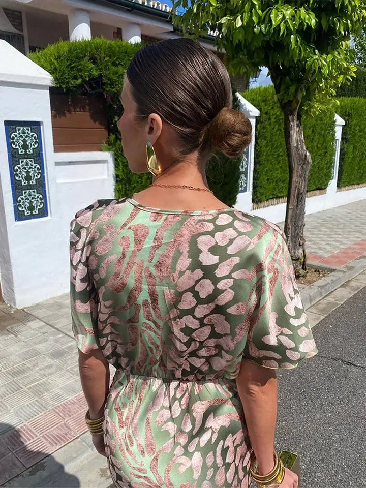 Woman wearing V-neck wrap maxi dress