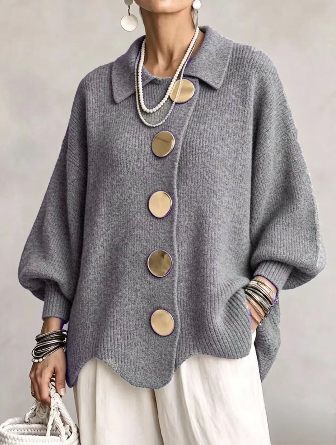 Woman wearing oversized cardigan with lantern sleeves