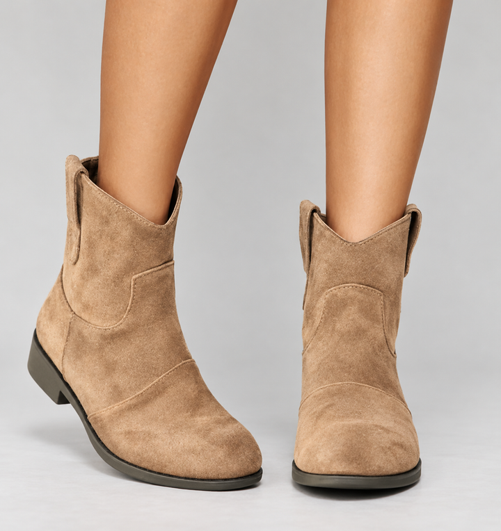 Woman wearing block heel orthopedic boots with side zip